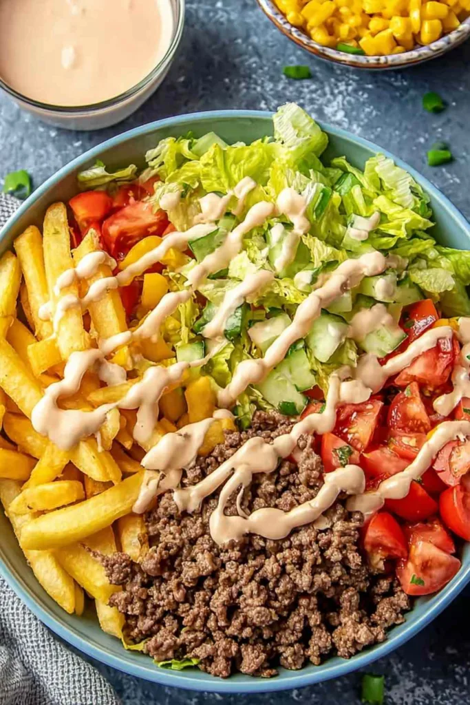 Big Mac Bowls served in a white bowl with special sauce drizzle