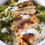 Chicken and Broccoli Bowls with Creamy Garlic Sauce in white bowls
