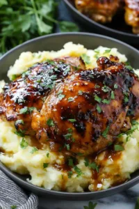 Chipotle Honey Chicken Thighs With Smoked Gouda Mashed Potatoes plated for dinner
