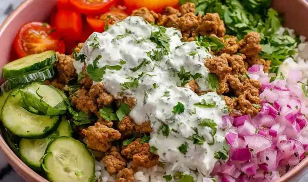ground turkey bowls with rice cucumber tomatoes and yogurt sauce