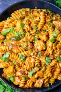 High Protein Chicken Fajita Pasta in a skillet with fresh parsley.