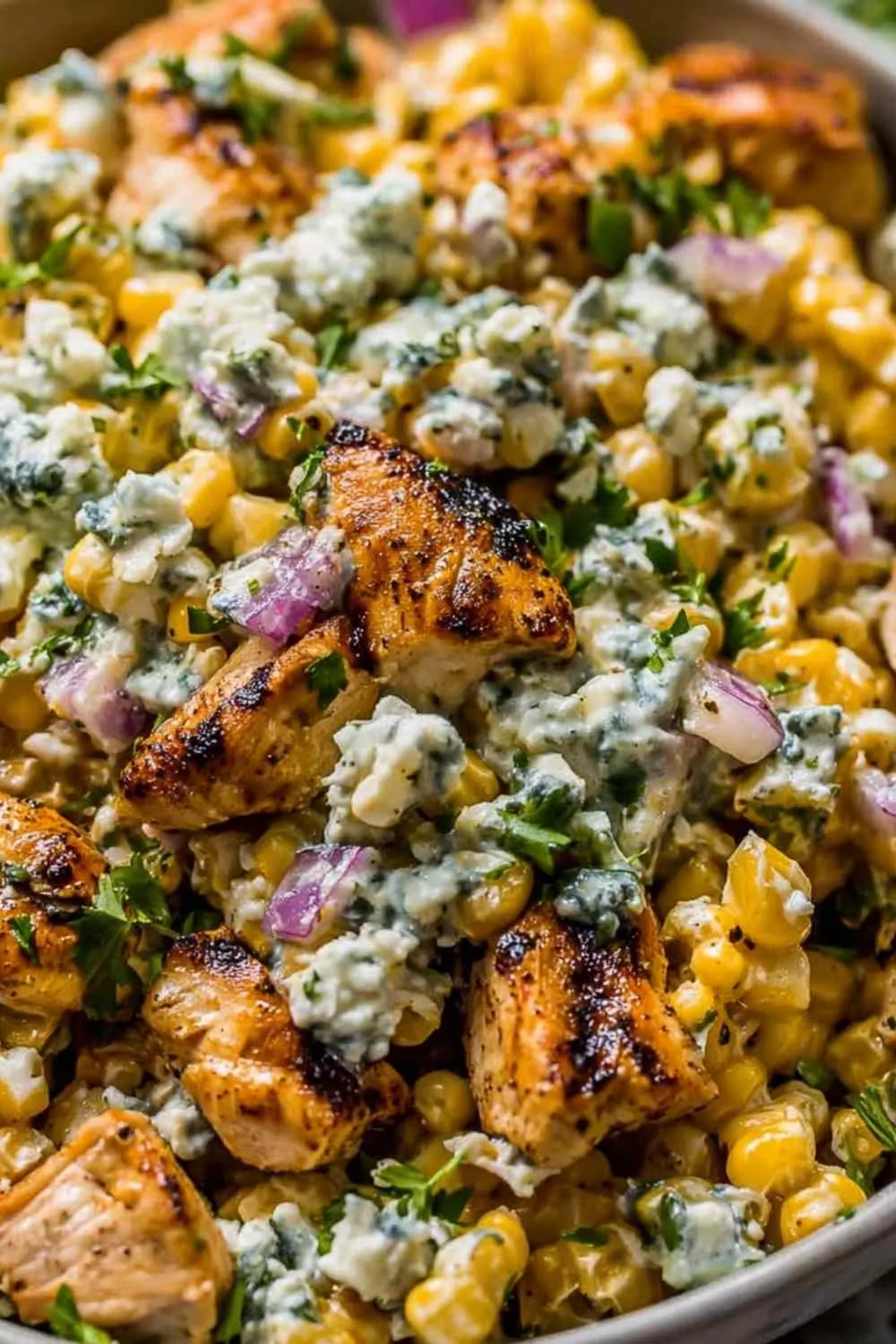 High Protein Chicken Street Corn Salad in a bowl with grilled chicken and fresh vegetables.