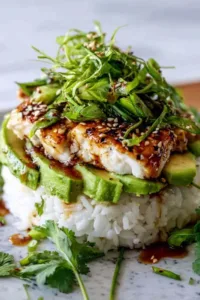Honey Lime Chicken Avocado Rice Stack in a white bowl with grilled chicken slices and fresh avocado