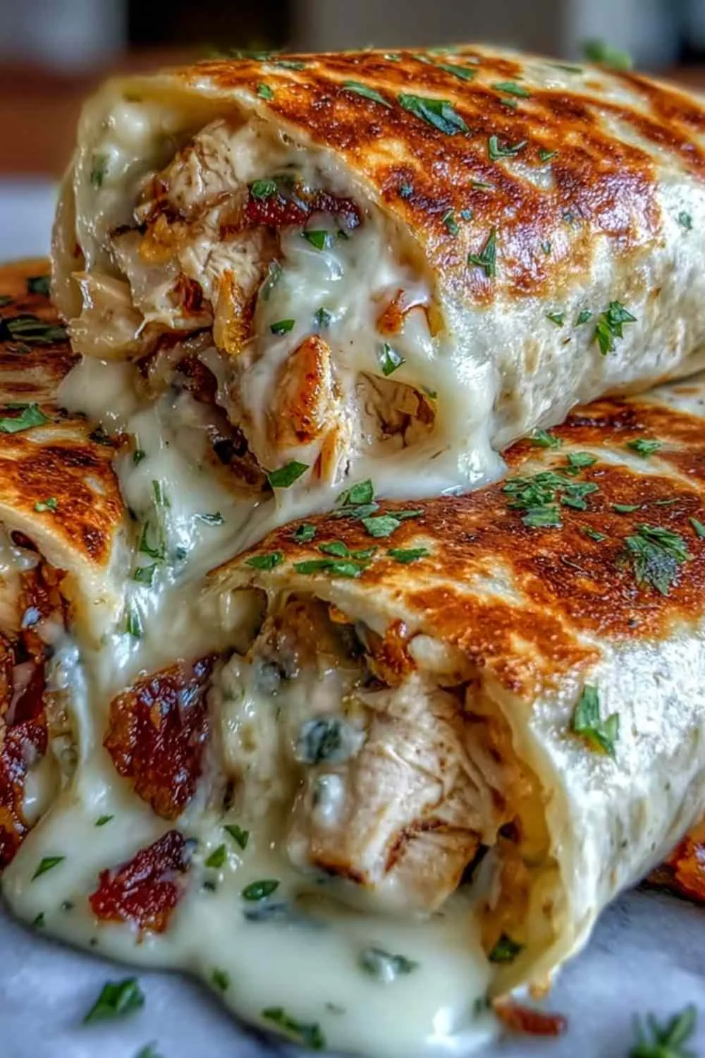 Low carb cheesy garlic chicken wraps golden and crispy in a skillet
