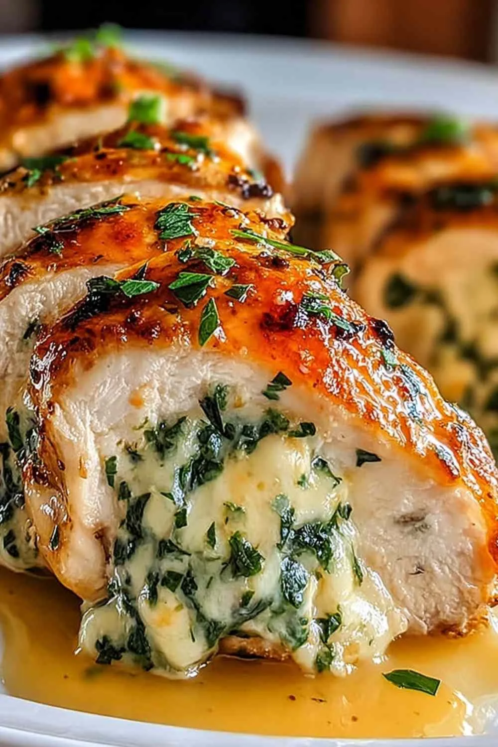 Ruth's Chris stuffed chicken copycat served on a white plate with roasted vegetables