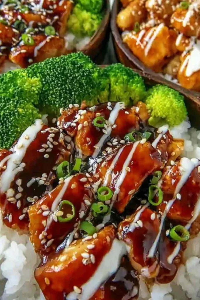 sticky chicken rice bowls with honey soy glaze broccoli and sesame seeds