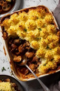 chicken mushroom pie with duchess potato topped with golden piped mashed potato and parmesan