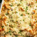 Chicken Tetrazzini pasta bake bubbling golden in a 9x13 pan fresh from the oven