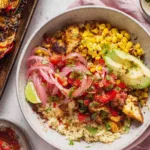 Chicken fajita bowls with seasoned chicken, roasted bell peppers, corn, and pico de gallo served over white rice