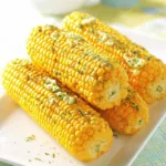 Corn on the cob with garlic herb butter slow cooker