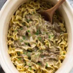 crock pot beef and noodles in slow cooker overhead view