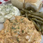 Crockpot Chicken and Gravy seasoned in a slow cooker