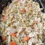Crockpot creamy chicken and noodles in a white bowl
