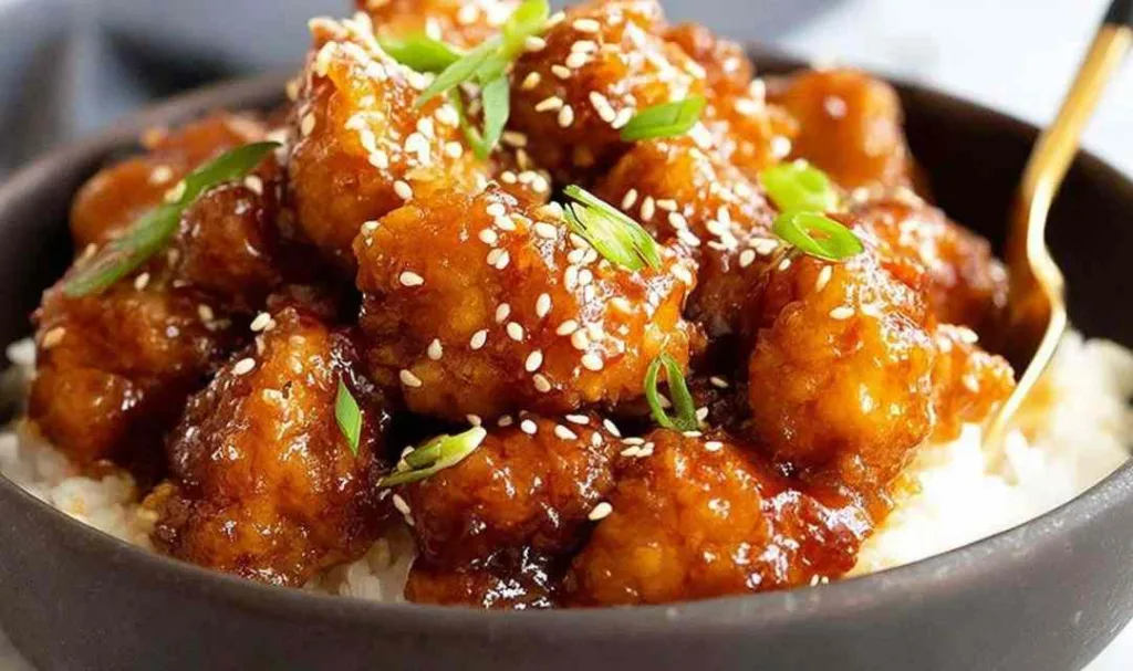 General Tso's Chicken crispy golden pieces in glossy sweet spicy sauce