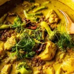 golden coconut chicken curry served over basmati rice with fresh cilantro and crispy shallots