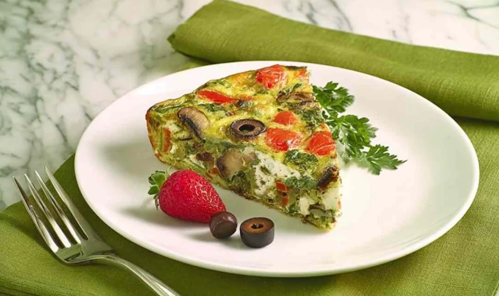 Mediterranean Frittata Slow Cooker Recipe sliced on a white plate