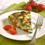 Mediterranean Frittata Slow Cooker Recipe sliced on a white plate