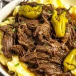 Mississippi Pot Roast served over mashed potatoes with rich savory gravy