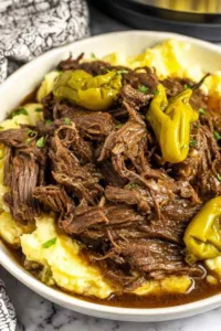 Mississippi Pot Roast served over mashed potatoes with rich savory gravy