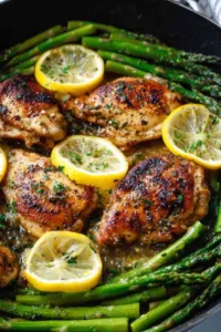 One pan lemon garlic butter chicken asparagus in a cast iron skillet