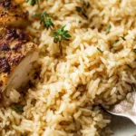 Oven baked chicken and rice in a white baking dish fresh from the oven