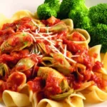 Artichoke pasta slow cooker recipe in a rustic bowl