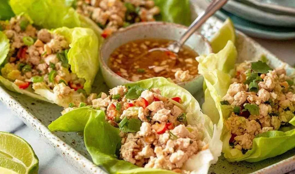 Thai lettuce wraps Larb Gai filled with spiced ground chicken, fresh mint, cilantro and crushed peanuts