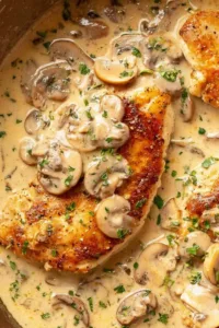 Chicken breast in creamy mushroom sauce in a skillet