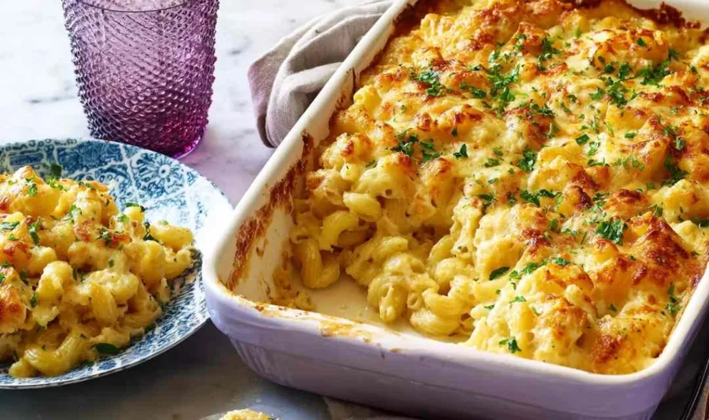 Golden cheesy chicken casserole bubbling in a baking dish fresh out of the oven