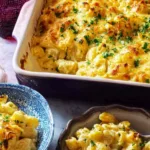 Golden cheesy chicken casserole bubbling in a baking dish fresh out of the oven