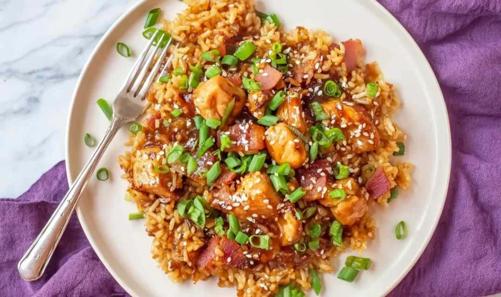Crockpot teriyaki chicken and rice with pineapple chunks and sesame seeds in a slow cooker