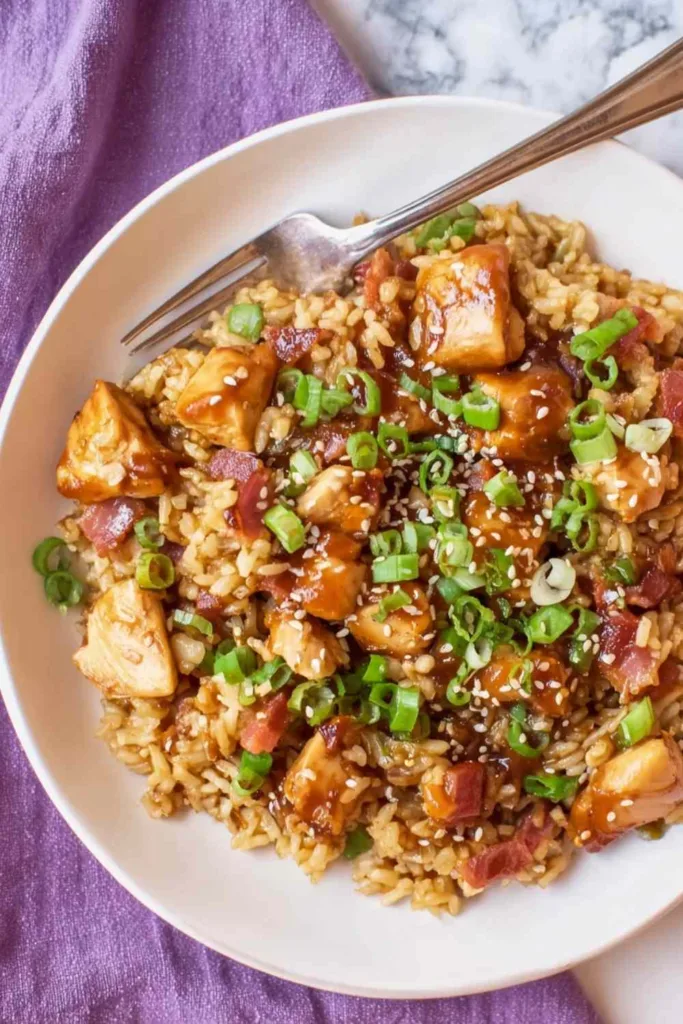 Crockpot teriyaki chicken and rice with pineapple chunks and sesame seeds in a slow cooker